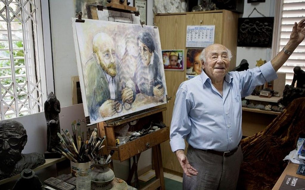 In this photo taken Tuesday, November 10, 2015, artist Itzchak Belfer, who grew up in an orphanage headed by Janusz Korczak, displays a painting of his mentor at his house in Tel Aviv, Israel. (AP Photo/Dan Balilty) In this photo taken Tuesday, November 10, 2015, artist Itzchak Belfer, who grew up in an orphanage headed by Janusz Korczak, displays a painting of his mentor at his house in Tel Aviv, Israel. (AP Photo/Dan Balilty)