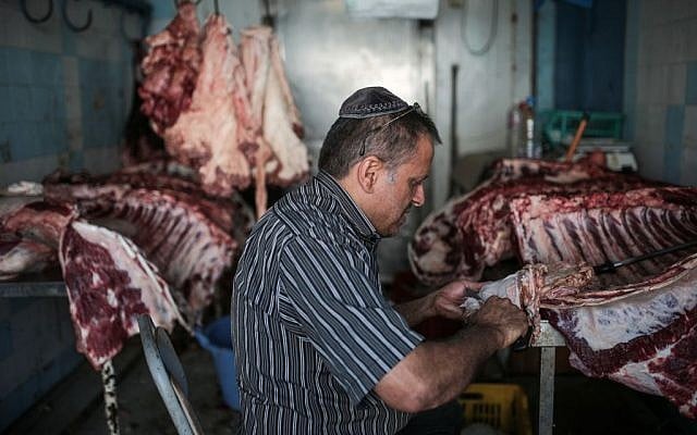Char Haddad, 45, prepares meat in his kosher slaughterhouse at Hara Kbira, the main Jewish neighborhood on the Island of Djerba, southern Tunisia, October 29, 2015. (Photo by AP Photo/Mosa'ab Elshamy) Char Haddad, 45, prepares meat in his kosher slaughterhouse at Hara Kbira, the main Jewish neighborhood on the Island of Djerba, southern Tunisia, October 29, 2015. (Photo by AP Photo/Mosa'ab Elshamy)