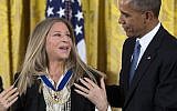 US President Barack Obama, right, presents the Presidential Medal of Freedom to Barbra Streisand during a ceremony in the East Room of the White House, on Tuesday, Nov. 24, 2015 (AP Photo via JTA/Evan Vucci)