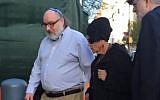 In this still image from video provided by WCBS-TV, convicted spy Jonathan Pollard, left, arrives at a federal courthouse in New York with his wife, Esther, to check in at a probation office just hours after he was released from prison on Friday, Nov. 20, 2015. (Ilana Gold/WCBS-TV via AP)