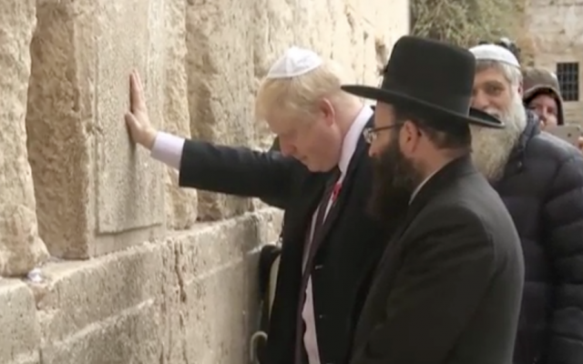 Boris Johnson at the Western Wall during a visit to Israel as mayor of London, November 2015 (Guardian screenshot) Boris Johnson at the Western Wall during a visit to Israel as mayor of London, November 2015 (Guardian screenshot)