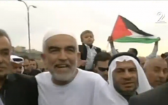 Islamic Movement Northern Branch head Raed Salah (center), and MK Jamal Zahalka (left) march in a demonstration on November 28, 2015 (Channel 2 screenshot)