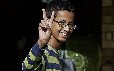 This Sept. 17, 2015, file photo shows Ahmed Mohamed, 14, gestures as he arrives to his family's home in Irving, Texas. (AP Photo/LM Otero, File)
