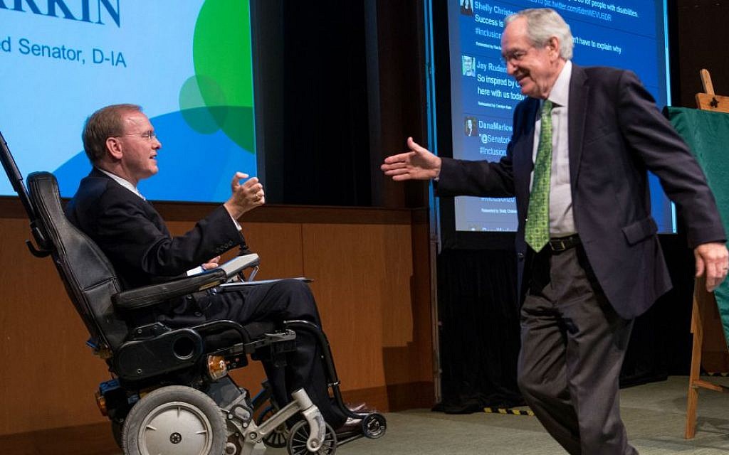 Rep. Jim Langevin, left, of Rhode Island greeting former Iowa Sen. Tom Harkin at the Ruderman Foundation Inclusion Summit in Boston, November 2015. (Noam Galai/via JTA)
