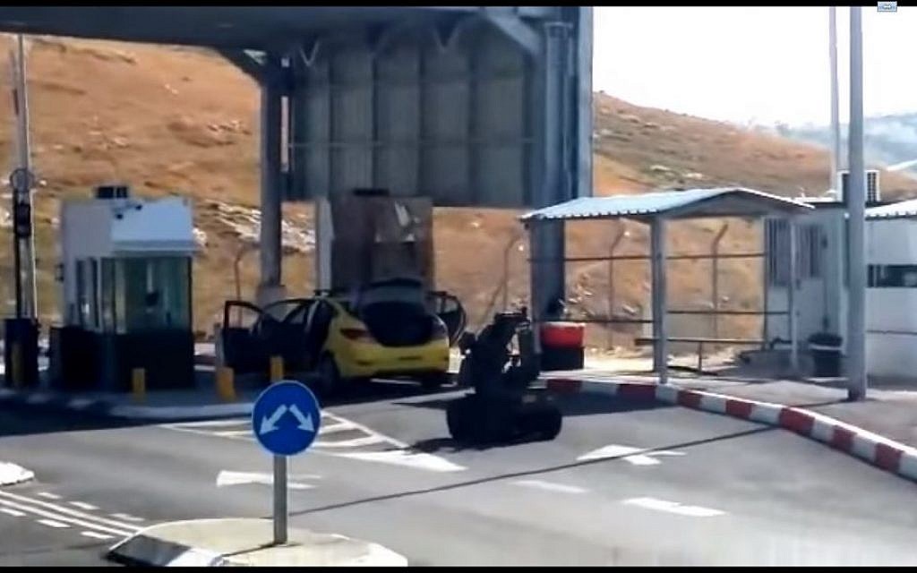 A police robot approaches a car carrying an explosive device, near the city of Hebron in the West Bank on Monday, November 2, 2015 (screen capture: YouTube) A police robot approaches a car carrying an explosive device, near the city of Hebron in the West Bank on Monday, November 2, 2015 (screen capture: YouTube)
