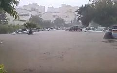 Cars immersed in water as flash floods hit the city of Ashkelon, November 9, 2014. (Screenshot from YouTube)