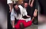 Members of the Adass Israel Synagogue in Melbourne tackle a drunken suspected thief in a confrontation on November 26, 2015. (screen capture: Daily Mail)