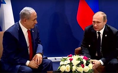 Prime Minister Benjamin Netanyahu (left) meets with Russian President Vladimir Putin on the sidelines of the COP 21 United Nations conference on climate change at Le Bourget, on the outskirts of Paris, France, on November 30, 2015. (screen capture: YouTube)