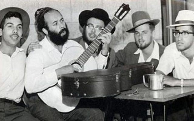 A young Rabbi Shlomo Carlebach playing guitar. (YouTube screenshot) A young Rabbi Shlomo Carlebach playing guitar. (YouTube screenshot)