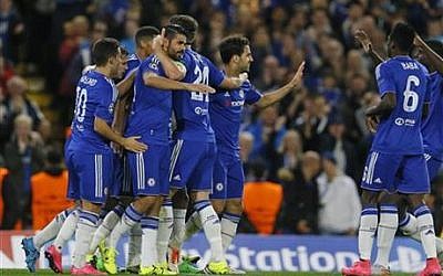 Chelsea players hug teammate Diego Costa, center left, after he scored during the Champions League group G soccer match between Chelsea and Maccabi Tel Aviv at Stamford Bridge stadium in London, Wednesday, Sept. 16, 2015 (AP/Kirsty Wigglesworth)