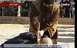 Screenshot from a Lebanese TV report allegedly showing the beheading of a Lebanese man lured to Raqqa, Syria by his son to be executed by the Islamic State terror group. The report aired on October 30, 2015. (Screenshot/MTV)