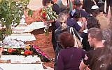 Mourners at a funeral for a 13-year-old girl who committed suicide in Kfar Saba on November 25, 2015. (screen capture: Channel 2)