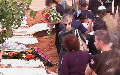 Mourners at a funeral for a 13-year-old girl who committed suicide in Kfar Saba on November 25, 2015. (screen capture: Channel 2)