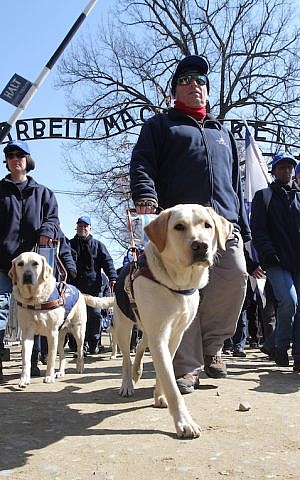 A blind participant in the March of the Living visiting Auschwitz. (Jacek Bendarczyk/EPA/via JTA)