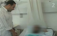 Eyal Haddad (L) meets with lynch victim Salem at Barzilai Hospital in Ashkelon, Sunday, November 22, 2015 (Channel 2 news)
