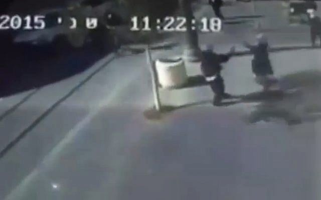 In a still image from security camera of the scene, a young Palestinian girl lashes out with a pair of scissors in an attack in Jerusalem on November 23, 2015 (screen capture: Channel 2)