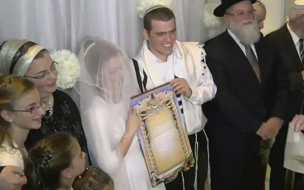 Sarah Techiya Litman and Ariel Beigel marry in Jerusalem in November 2015, two weeks after her brother and father were killed in a terror attack (YouTube screenshot)
