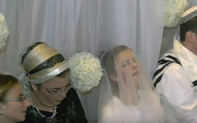Sarah Techiya Litman, whose father and brother were killed in a terror attack two weeks ago, is married in Jerusalem on November 26, 2015 (YouTube screenshot)