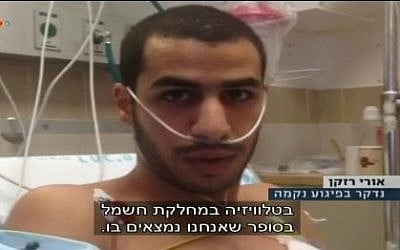 Uri Razkan, a Jewish Israeli, was stabbed in Kiryat Ata on October 13 after a Jewish attacker thought he was an Arab (screen capture: Channel 10)