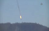 A Russian jet plunges to the ground after being shot down by Turkey near the border with Syria on November 24, 2015. (screen capture: Anadolu Agency)