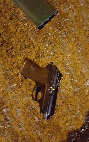 A pistol the IDF says was used in a shooting attack on soldiers in the West Bank on November 17, 2015. (IDF Spokesman's Unit) A pistol the IDF says was used in a shooting attack on soldiers in the West Bank on November 17, 2015. (IDF Spokesman's Unit)