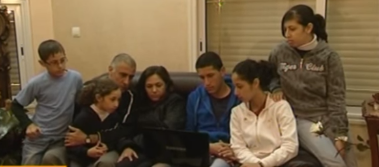 Zinati reunited with his wife and children (YouTube)