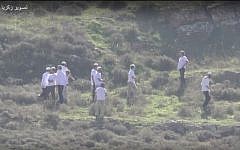Settlers on a hilltop near the Palestinian village of Madama in the West Bank. (Screen capture YouTube)