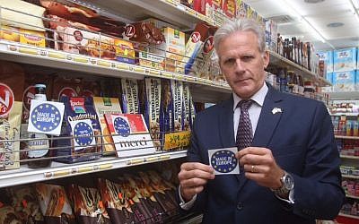 Kulanu MK Michael Oren shows a 'Made in Europe' label he prepared a few weeks earlier, in response to the European decision to label products made in territories Israel captured in the Six Day War in 1967. (Courtesy Michael Oren)