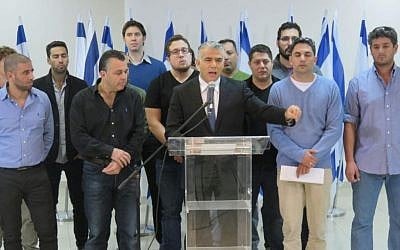 Yesh Atid party leader MK Yair Lapid (center) together with  Amit Deri (2nd right) IDF reserve officers and soldiers at a press conference against the Breaking the Silence group, December 20, 2015. (Yesh Atid spokesperson)