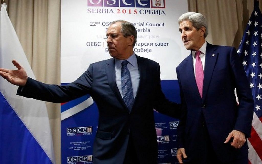 Russian Foreign Minister Sergei Lavrov (L) invites US Secretary of State John Kerry to a sitting area as he arrives for their bilateral meeting alongside the annual Organization for Security and Cooperation in Europe (OSCE) Ministerial Council meeting in Belgrade on December 3, 2015. (AFP/POOL/JONATHAN ERNST)
