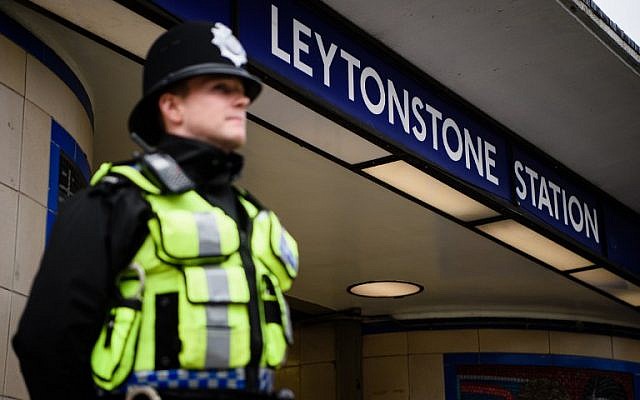 A police officer stands guard outside Leytonstone station in north London on December 6, 2015, a day after three people were stabbed by Zakaria Bulhan,  a 19-year-old Somali-Norwegian man (AFP/LEON NEAL)