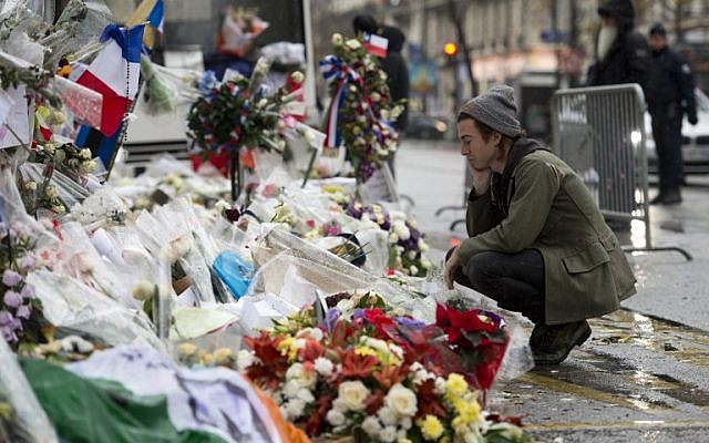Drummer of the US rock group Eagles of Death metal Julian Dorio pays tribute to the victims of the November 13 Paris terrorist attacks at a makeshift memorial in front of the Bataclan concert hall in Paris on December 8, 2015. (Miguel Medina/AFP) Drummer of the US rock group Eagles of Death metal Julian Dorio pays tribute to the victims of the November 13 Paris terrorist attacks at a makeshift memorial in front of the Bataclan concert hall in Paris on December 8, 2015. (Miguel Medina/AFP)