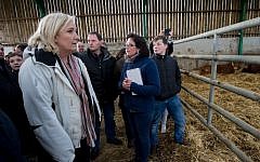 Marine Le Pen, French far-right National Front (FN) president, and candidate in the Nord-Pas-de-Calais Picardie region for the second round of the regional elections, visits a farm as part of her electoral campaign in Quesmy, on December 10, 2015 AFP/DENIS CHARLET)