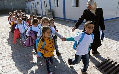 Syrian refugee children arrive for class at the refugee camp in Osmaniye, Turkey on December 15, 2015. (AFP/ADEM ALTAN)
