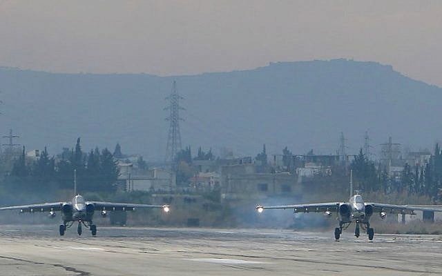 Two Russian Sukhoi Su-24 bombers at the Russian Hmeimin military base in Latakia province, in the northwest of Syria, on December 16, 2015. (Paul Gypteau/AFP)