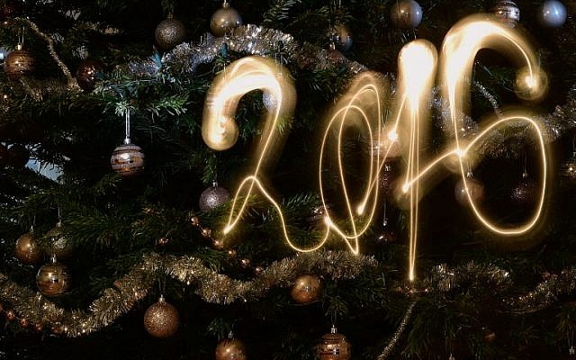 This long-exposure picture taken in Budapest on December 31, 2015 shows the new year 2016 written with a flashlight in front of a Christmas tree. (AFP/Attila Kisbenedek) This long-exposure picture taken in Budapest on December 31, 2015 shows the new year 2016 written with a flashlight in front of a Christmas tree. (AFP/Attila Kisbenedek)