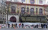 People gather to lay flowers at a makeshift memorial in front of the Bataclan concert hall on November 29, 2015, Paris. (AFP/MIGUEL MEDINA)