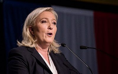 French far-right Front National party head Marine Le Pen reacts to first-round results in regional elections in the Nord Picardie region on December 6, 2015 at a polling station in Henin-Beaumont. (AFP Photo/Denis Charlet)