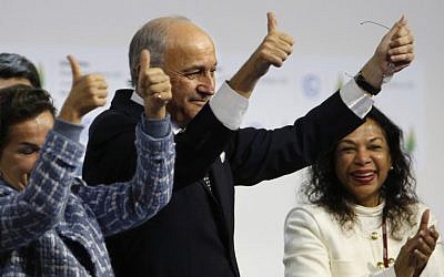French Foreign Affairs Minister and President-designate of COP21 Laurent Fabius gestures after adoption of a historic global warming pact at the COP21 Climate Conference in Le Bourget, north of Paris, on December 12, 2015. (AFP PHOTO / FRANCOIS GUILLOT / AFP / FRANCOIS GUILLOT)