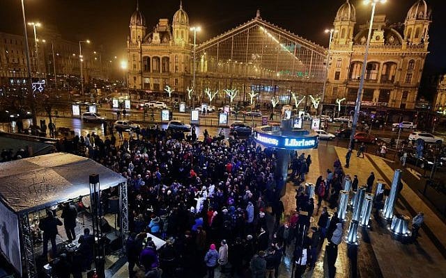 Hanukkah celebrants dance and sing at Nyugati Square in Budapest, December 6, 2015, the first day of the eight-day festival. (AFP Photo/Attila Kisbenedek) Hanukkah celebrants dance and sing at Nyugati Square in Budapest, December 6, 2015, the first day of the eight-day festival. (AFP Photo/Attila Kisbenedek)