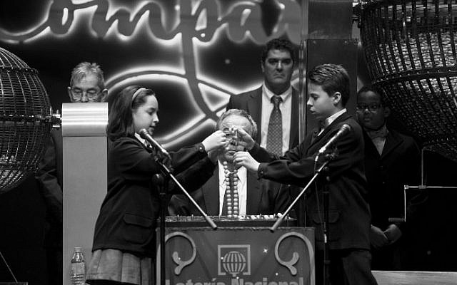 Pupils from San Ildefonso school sing out numbers during the draw of Spain's Christmas lottery named "El Gordo" (The Fat One) at the Teatro Real in Madrid, on December 22, 2015. (AFP Photo/Pierre-Philippe Marcou) Pupils from San Ildefonso school sing out numbers during the draw of Spain's Christmas lottery named "El Gordo" (The Fat One) at the Teatro Real in Madrid, on December 22, 2015. (AFP Photo/Pierre-Philippe Marcou)
