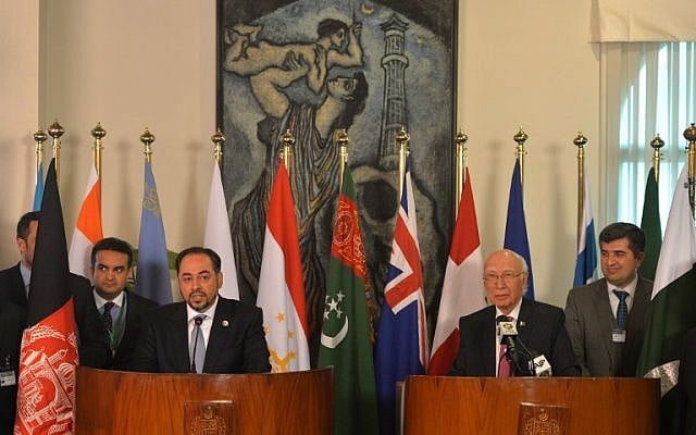 Afghan Foreign Minister Salahuddin Rabbani (left) speaks during a joint press conference with Pakistan's National Security Advisor Sartaj Aziz (right) at The Foreign Ministry in Islamabad on December 9, 2015. Afghan president Ashraf Ghani arrived in Islamabad hoping to revive peace talks with the resurgent Taliban. (Aami Qureshi/AFP)