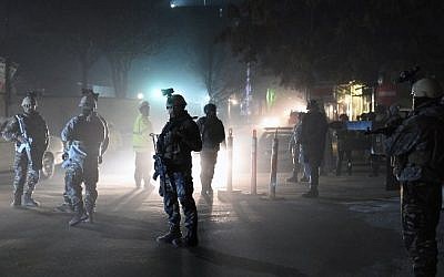 Afghan Crisis Response Unit personnel stand guard at the site of bomb attack on the Spanish embassy compound in Kabul on December 11, 2015 (AFP/Wakil Kohsar)