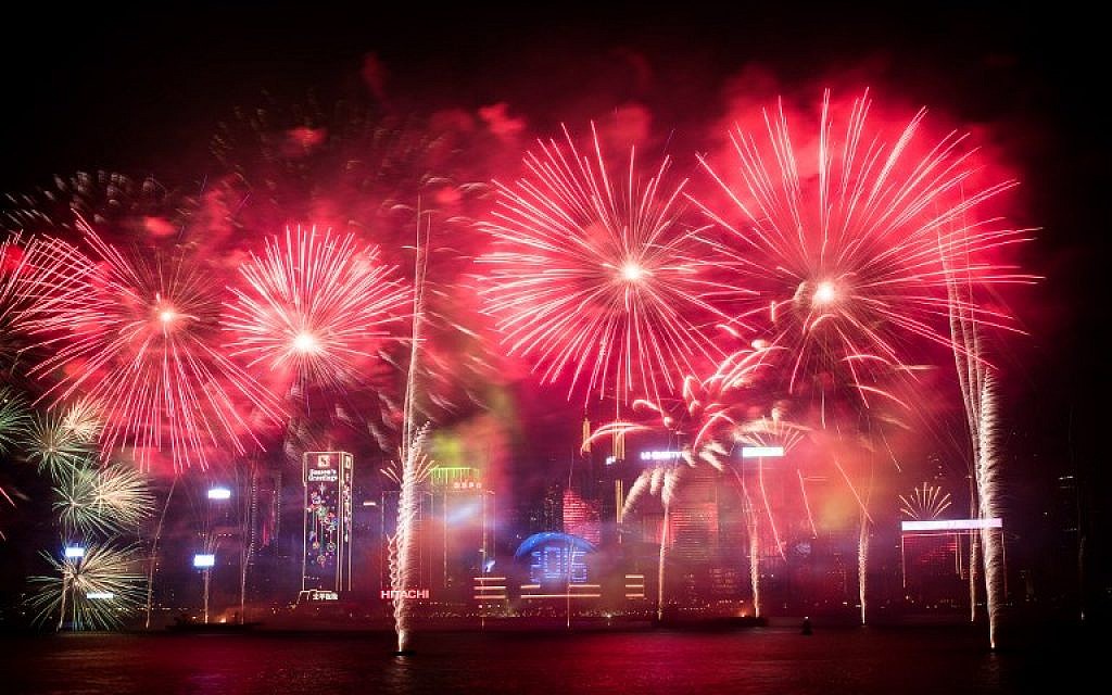 Fireworks are seen over the city's skyline in Hong Kong on January 1, 2016 as part of the 2016 new year celebrations. (AFP PHOTO / Philippe Lopez)