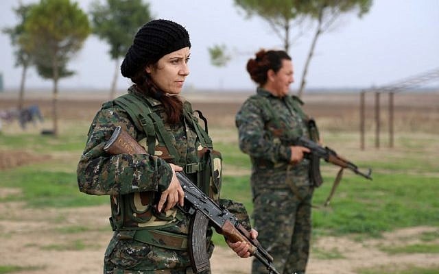Syriac Christian women, members of the battalion called the "Female Protection Forces of the Land Between the Two Rivers" fighting the Islamic State group, take part in a training on December 1, 2015 at their camp in the town of al-Qahtaniyah, near the Syrian-Turkish border (aka Kabre Hyore in Syriac, and Tirbespi in Kurdish).(AFP PHOTO / DELIL SOULEIMAN / AFP / DELIL SOULEIMAN)