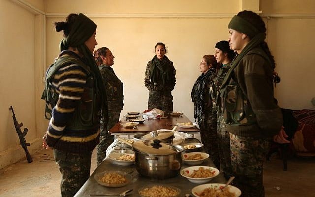 Syriac Christian women, members of the battalion called the "Female Protection Forces of the Land Between the Two Rivers" fighting the Islamic State group, take part in a training on December 1, 2015 at their camp in the town of al-Qahtaniyah, near the Syrian-Turkish border (aka Kabre Hyore in Syriac, and Tirbespi in Kurdish).(AFP PHOTO / DELIL SOULEIMAN / AFP / DELIL SOULEIMAN)