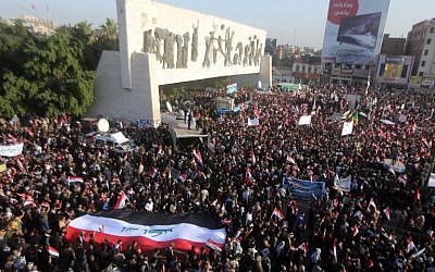 Iraqi protesters, most of them members of Shiite paramilitary forces, hold a demonstration to demand the withdrawal of Turkish forces from Iraq, in Baghdad's Tahrir Square, December 12, 2015. (AFP/Ahmad al-Rubaye)