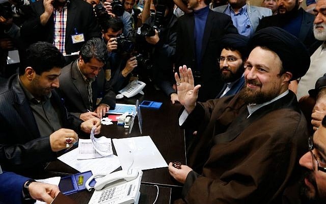 Hassan Khomeini (R), grandson of the Islamic Republic of Iran's founder, Ayatollah Ruhollah Khomeini, registers his candidacy for the Assembly of Experts elections at the interior ministry in Tehran on December 18, 2015. (AFP Photo/STR) Hassan Khomeini (R), grandson of the Islamic Republic of Iran's founder, Ayatollah Ruhollah Khomeini, registers his candidacy for the Assembly of Experts elections at the interior ministry in Tehran on December 18, 2015. (AFP Photo/STR)