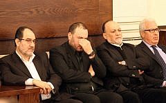 Bassam Kuntar (2nd left), brother of Samir Kuntar who was killed last night in a reported Israeli air-raid on his home in the Jaramana district on the outskirts of the Syrian capital Damascus, sits next to Hezbollah MP Ali Ammar (2nd right) as they receive condolences in the southern suburb of the Lebanese capital Beirut on December 20, 2015. (AFP PHOTO/ANWAR AMRO)
