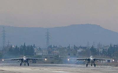 Two Russian Sukhoi Su-24 bombers at the Russian Hmeimim military base in Latakia province, in the northwest of Syria, December 16, 2015. (Photo by AFP Photo/Paul Gypteau)